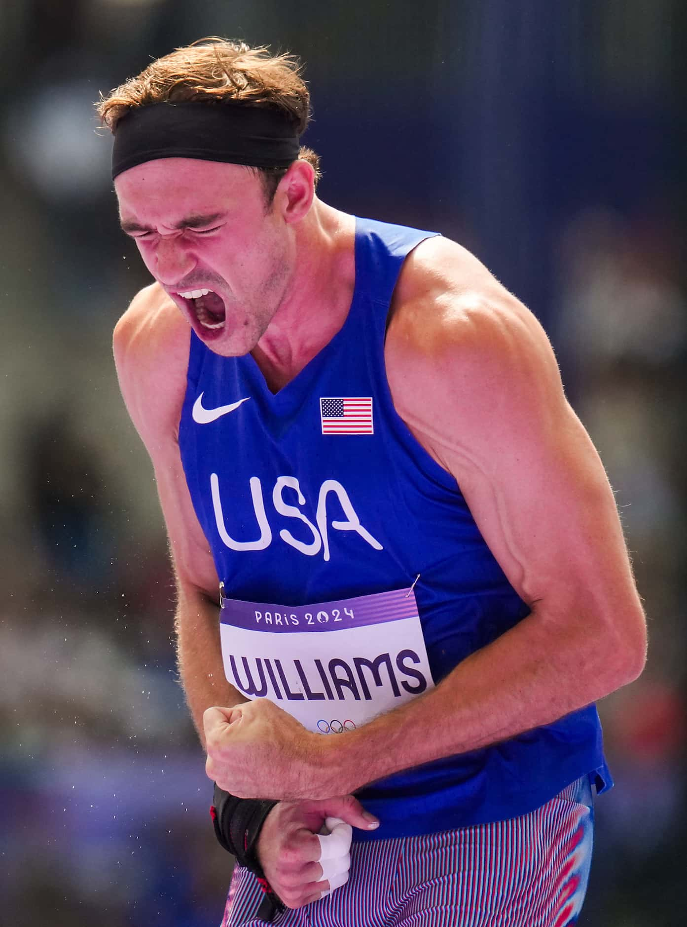 Harrison Williams of the United States celebrates after a result of 15.66 in the decathlon...