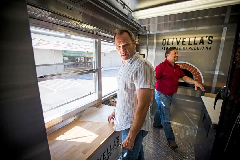 
Workers meet in Toyota’s temporary digs in Plano. Furniture suppliers have set up model...