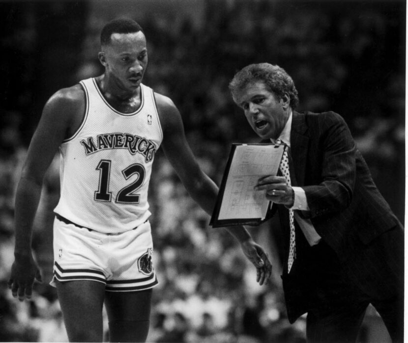  Mavericks coach John MacLeod shows point guard Derek Harper a new play.