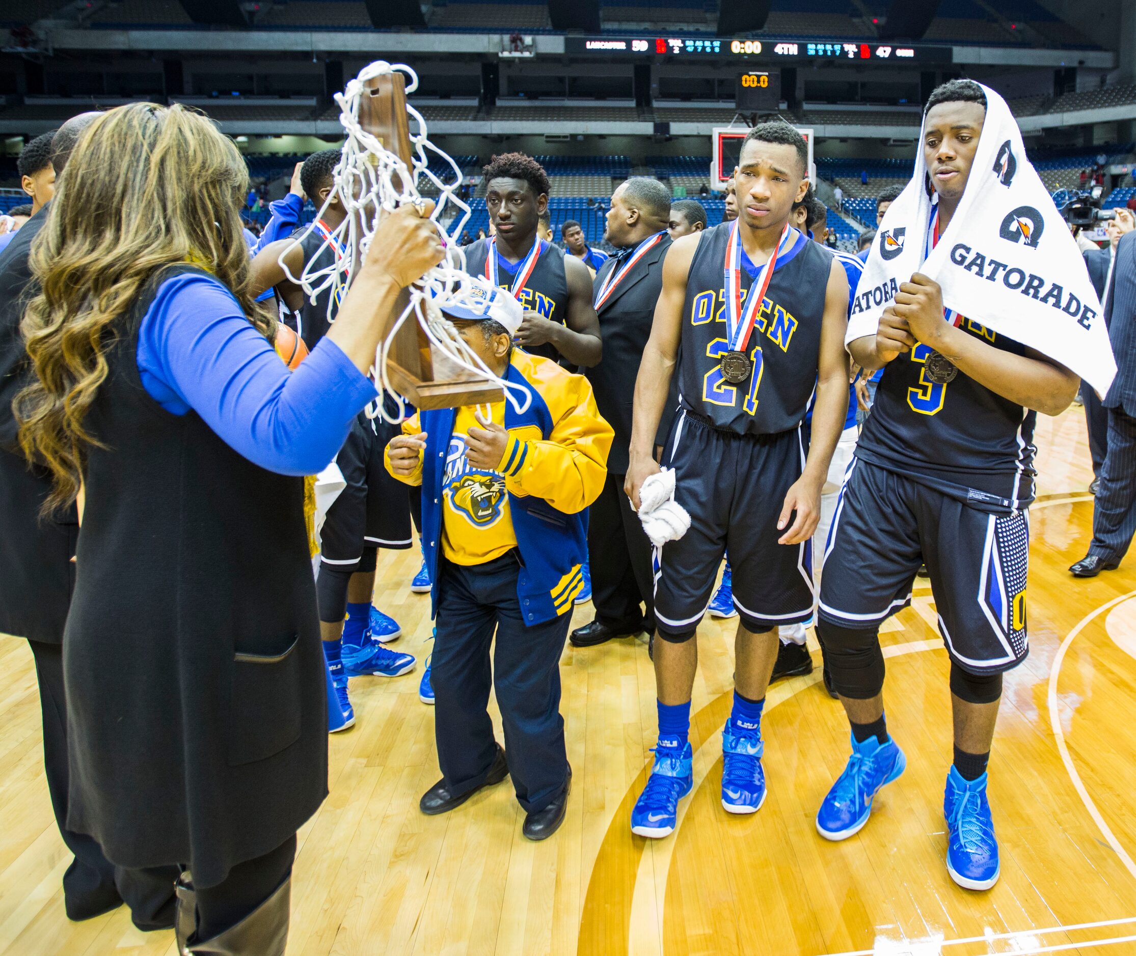 Beaumont Ozen receives a second place trophy after a 59-47 loss to Lancaster at their UIL...