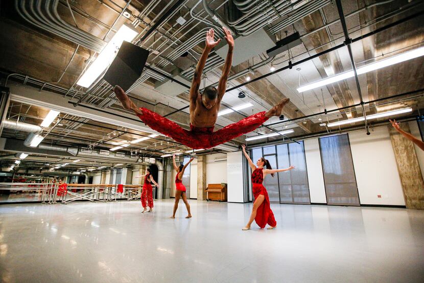 Dancer Xavier Santafield rehearses "Nissi" with fellow B. Moore Dance company members, at...
