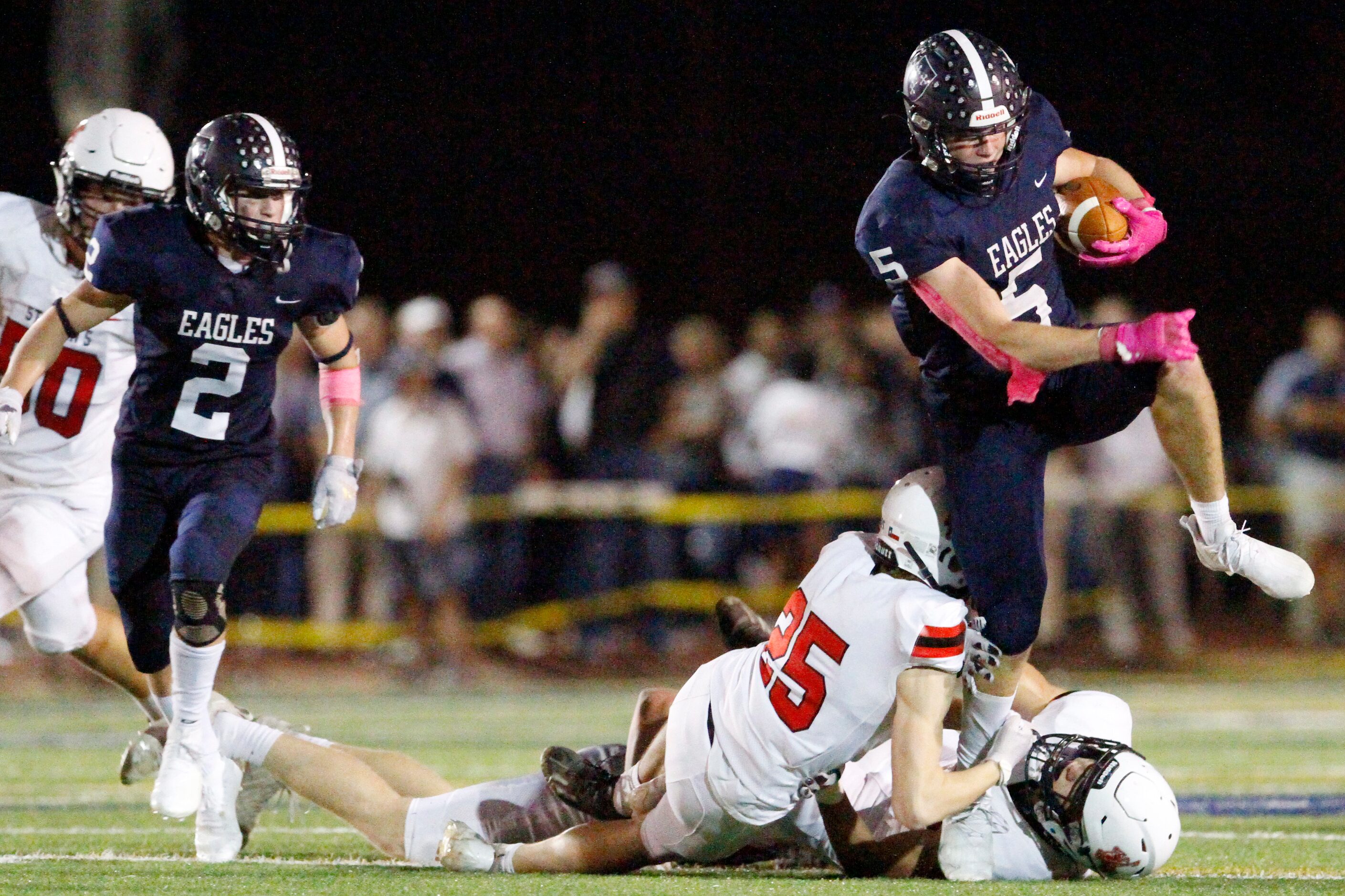 Episcopal School of Dallas sophomore running back Collin Nicholson (5) runs over Houston St....