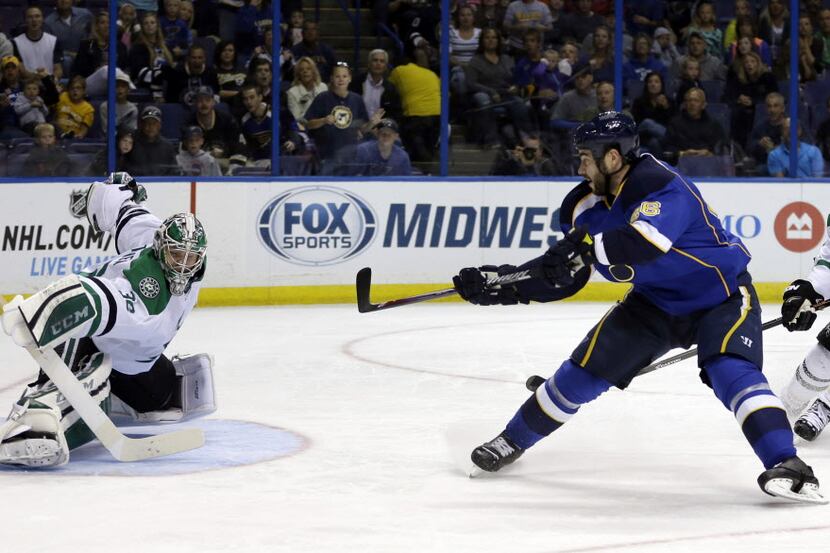 Dallas Stars goalie Kari Lehtonen, of Finland, deflects a shot from St. Louis Blues' Roman...