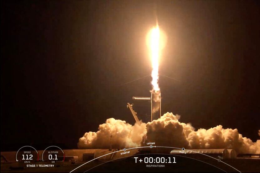 This screengrab taken from the SpaceX live webcast shows a SpaceX Falcon 9 rocket carrying...