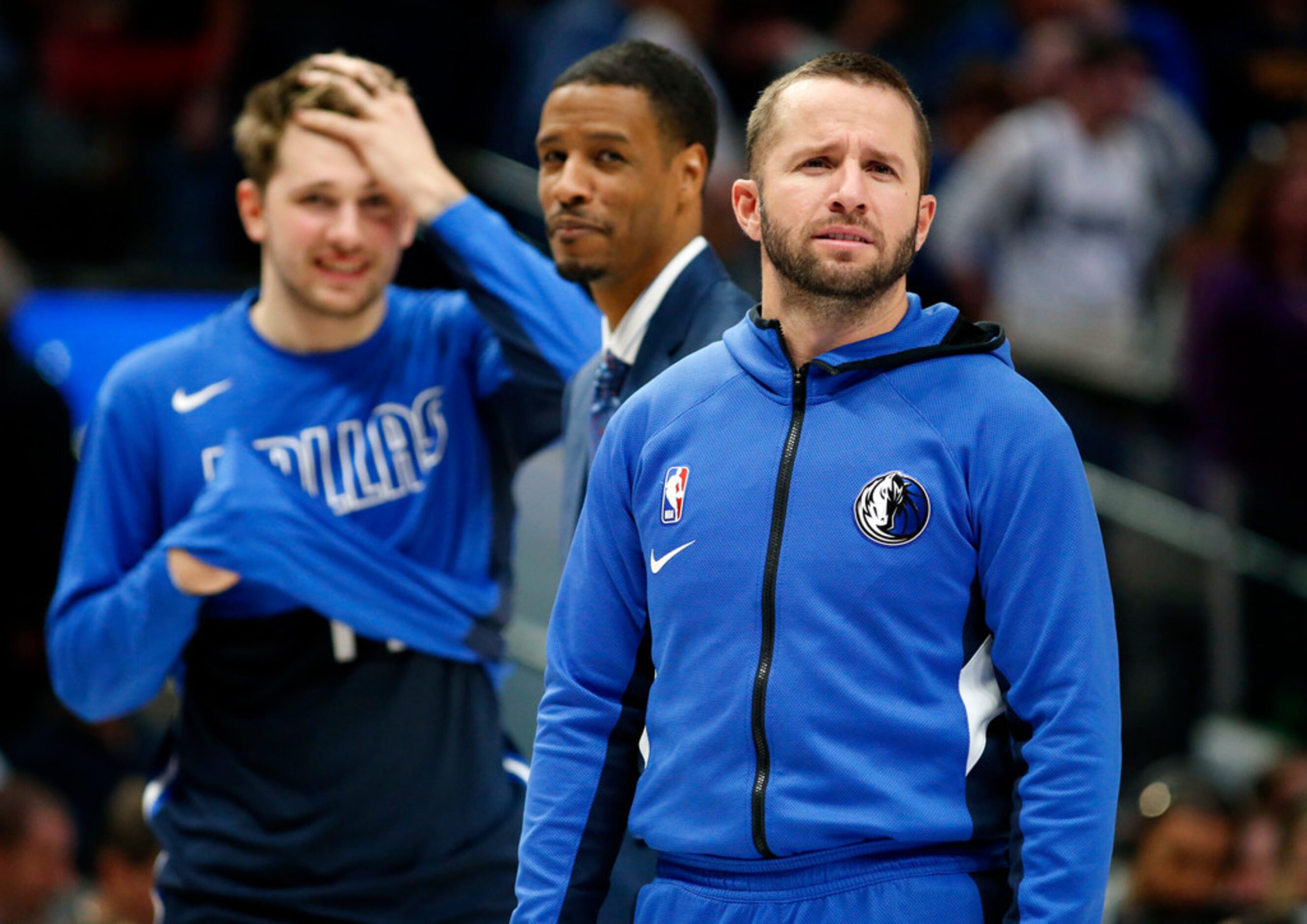 Dallas Mavericks guard J.J. Barea looks to someone he knows in the stands during a fourth...