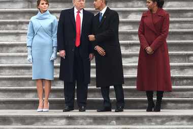 US First Lady Melania Trump and President Donald Trump stand with former President Barack...