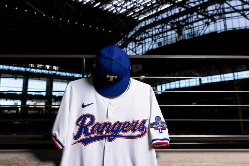 A gold-trimmed Texas Rangers jersey and cap from the team's "Gold Collection" celebrating...
