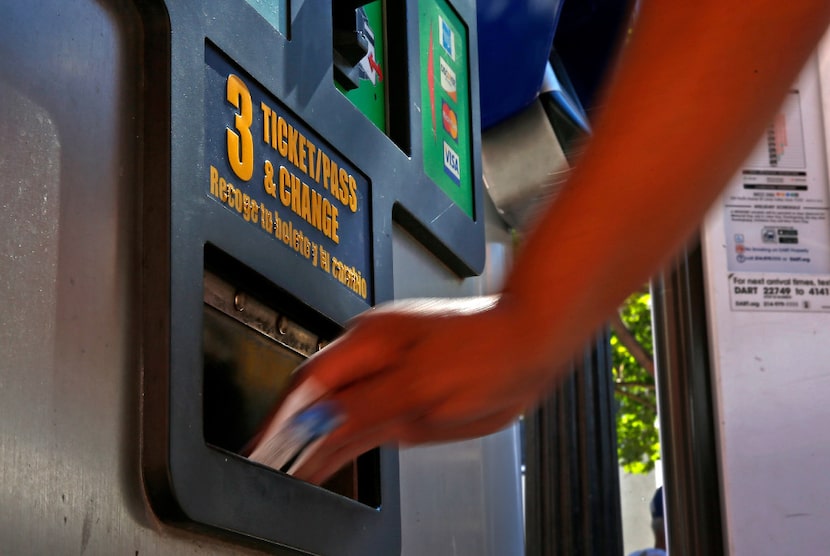 A commuter purchases a DART ticket at the West End Station in Dallas on Wednesday.