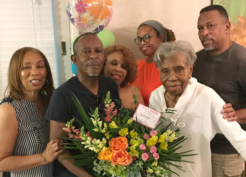 Annie Ruth Robertson's five children gather around her during her 95th birthday celebration...