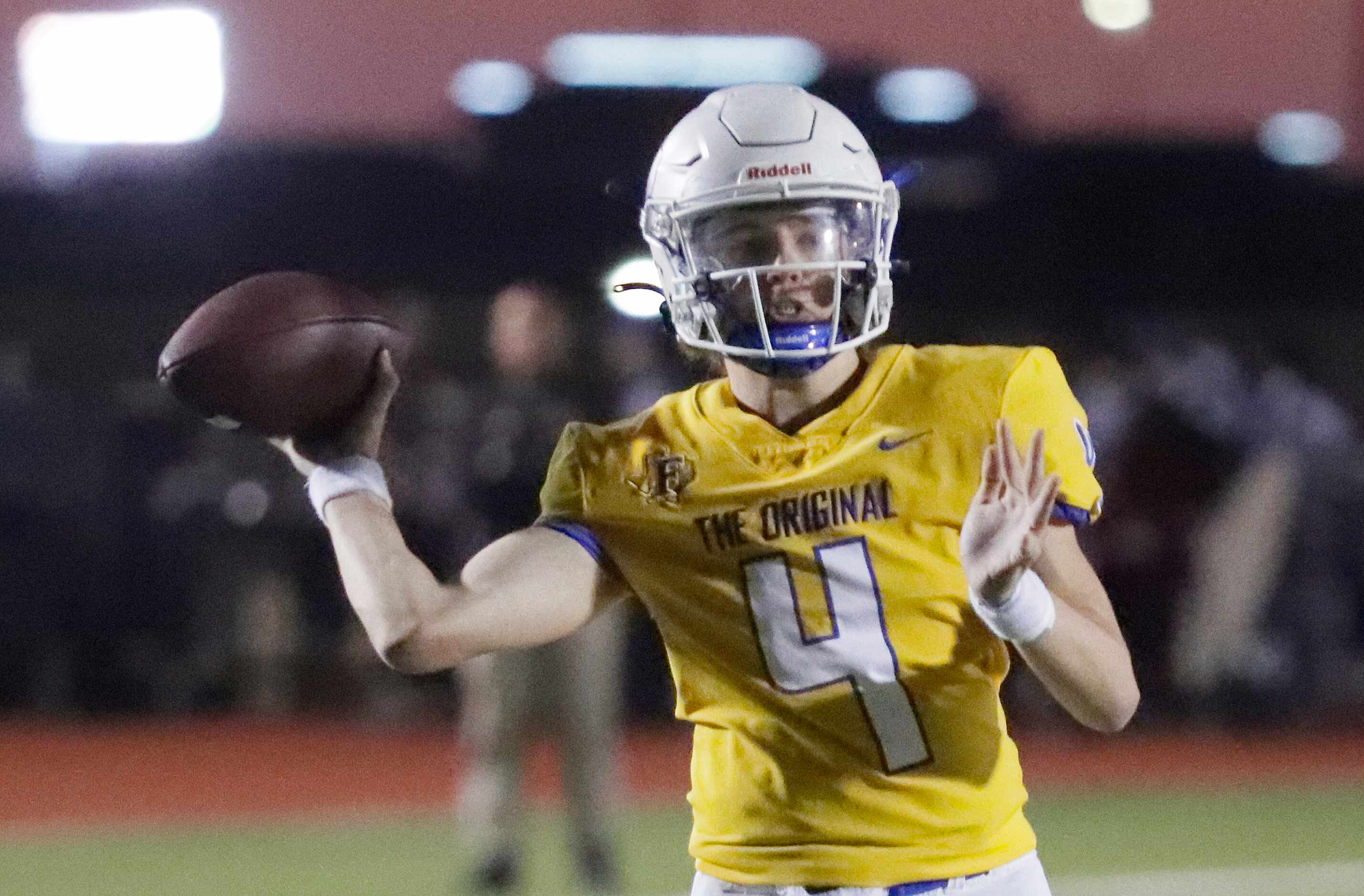 Frisco High School quarterback Camren Gibson (4) throws a pass during the first half as...