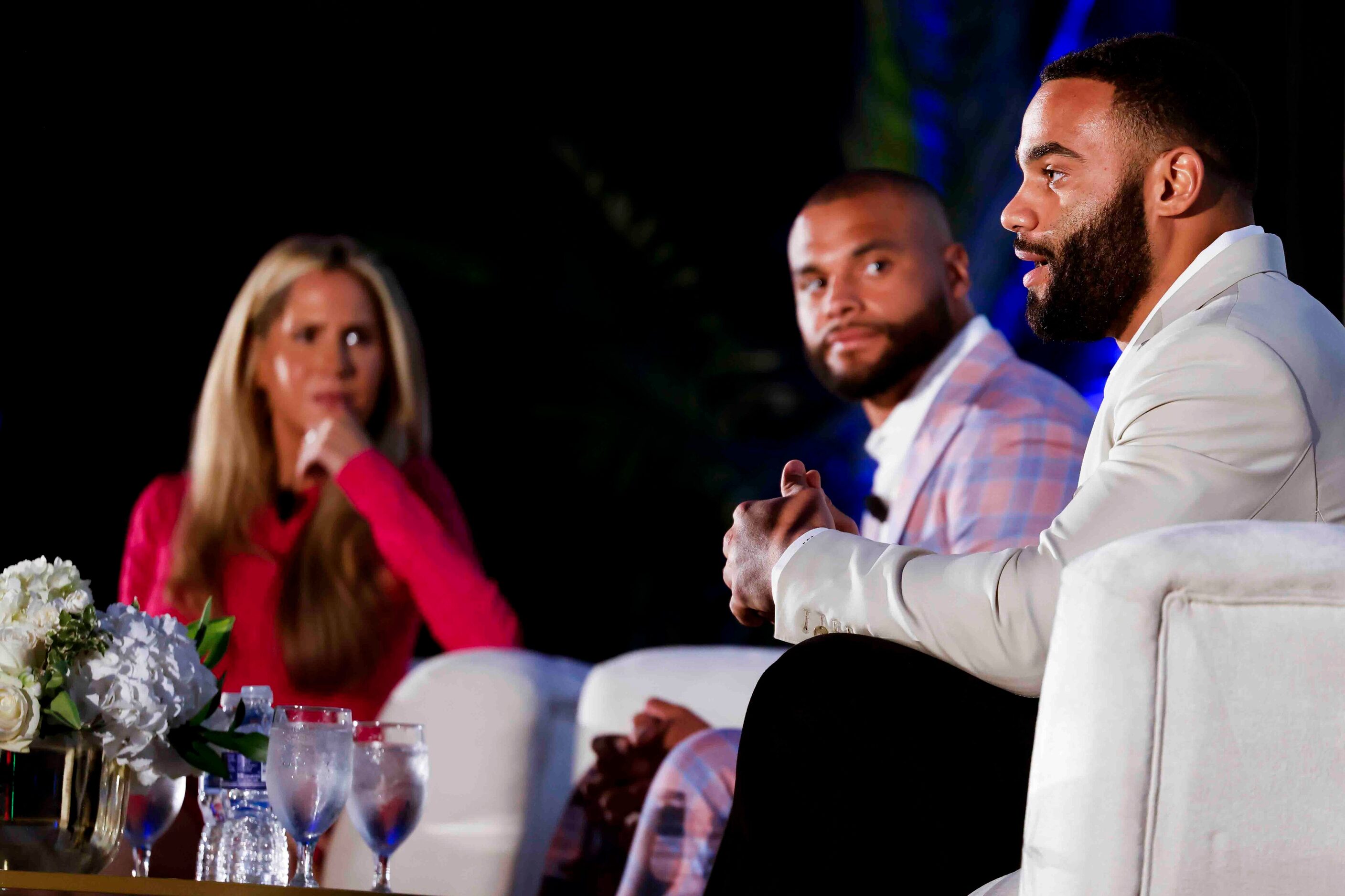 Moderator Andy Adler of CBS 11 (left), Cowboys QB Dak Prescott (center) listen to Solomon...