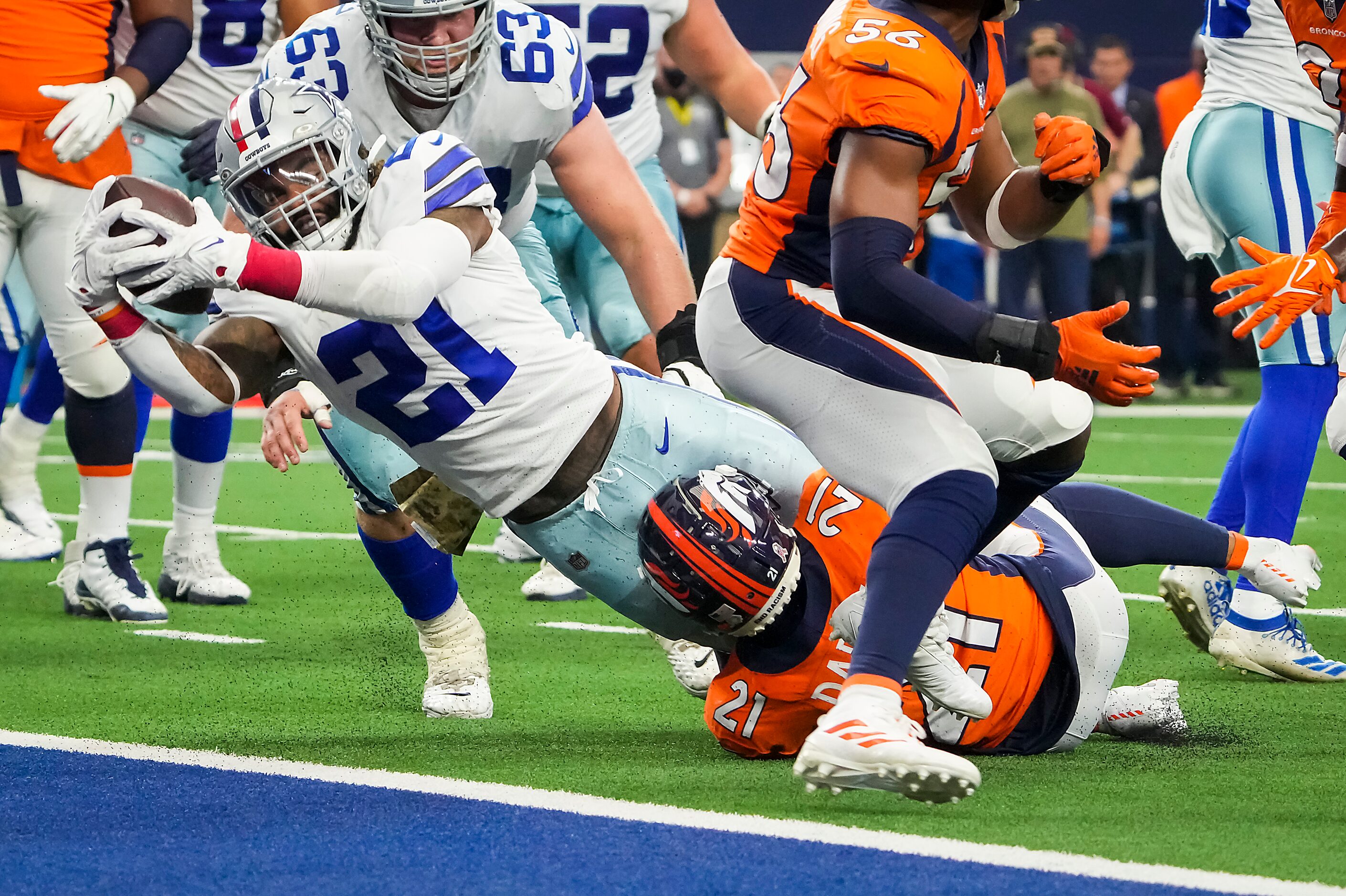 Dallas Cowboys running back Ezekiel Elliott (21) dives for a two-point conversion as Denver...