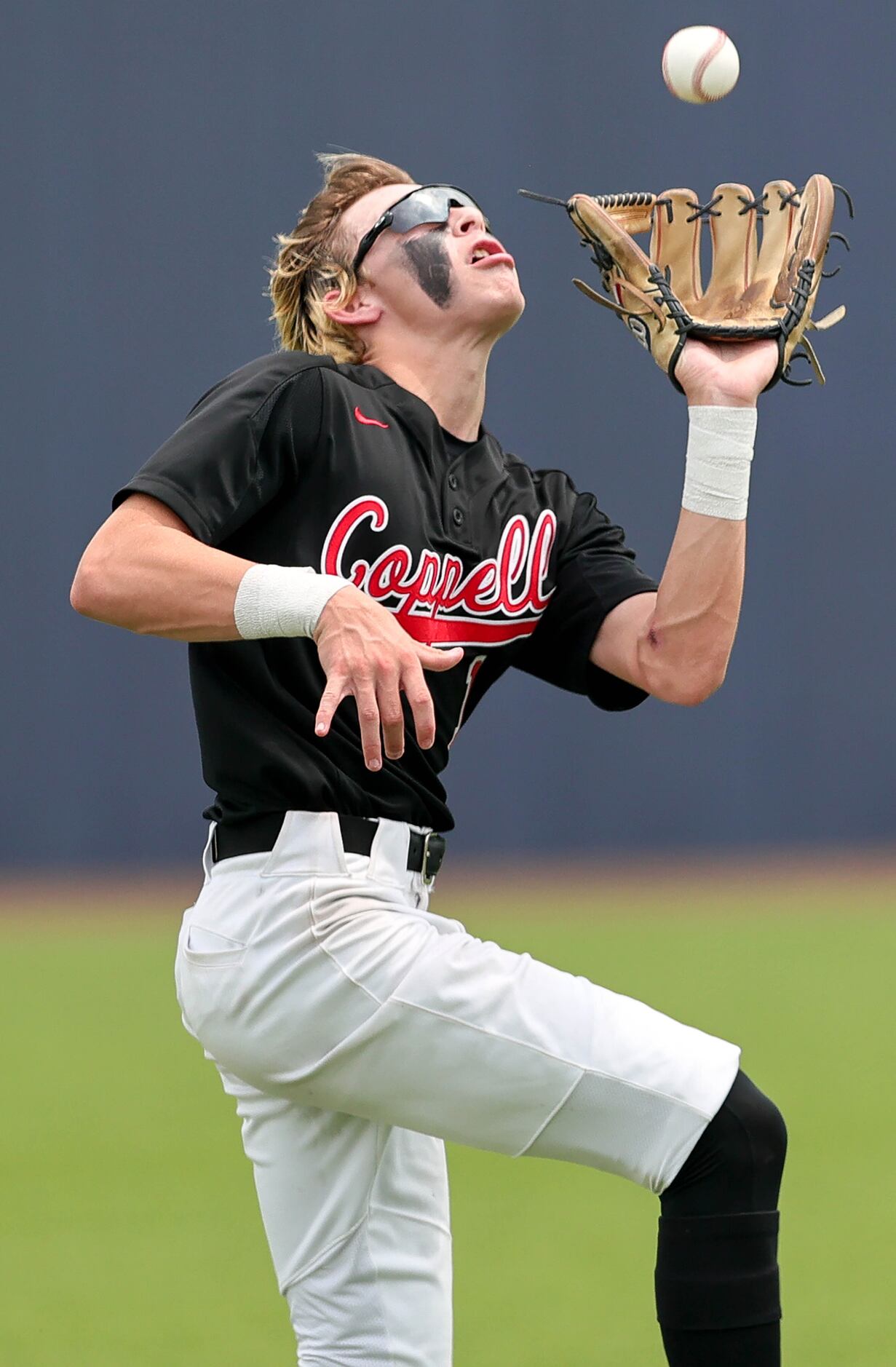 Coppell second baseman Michael Russell comes up with a catch against Prosper during game 3...