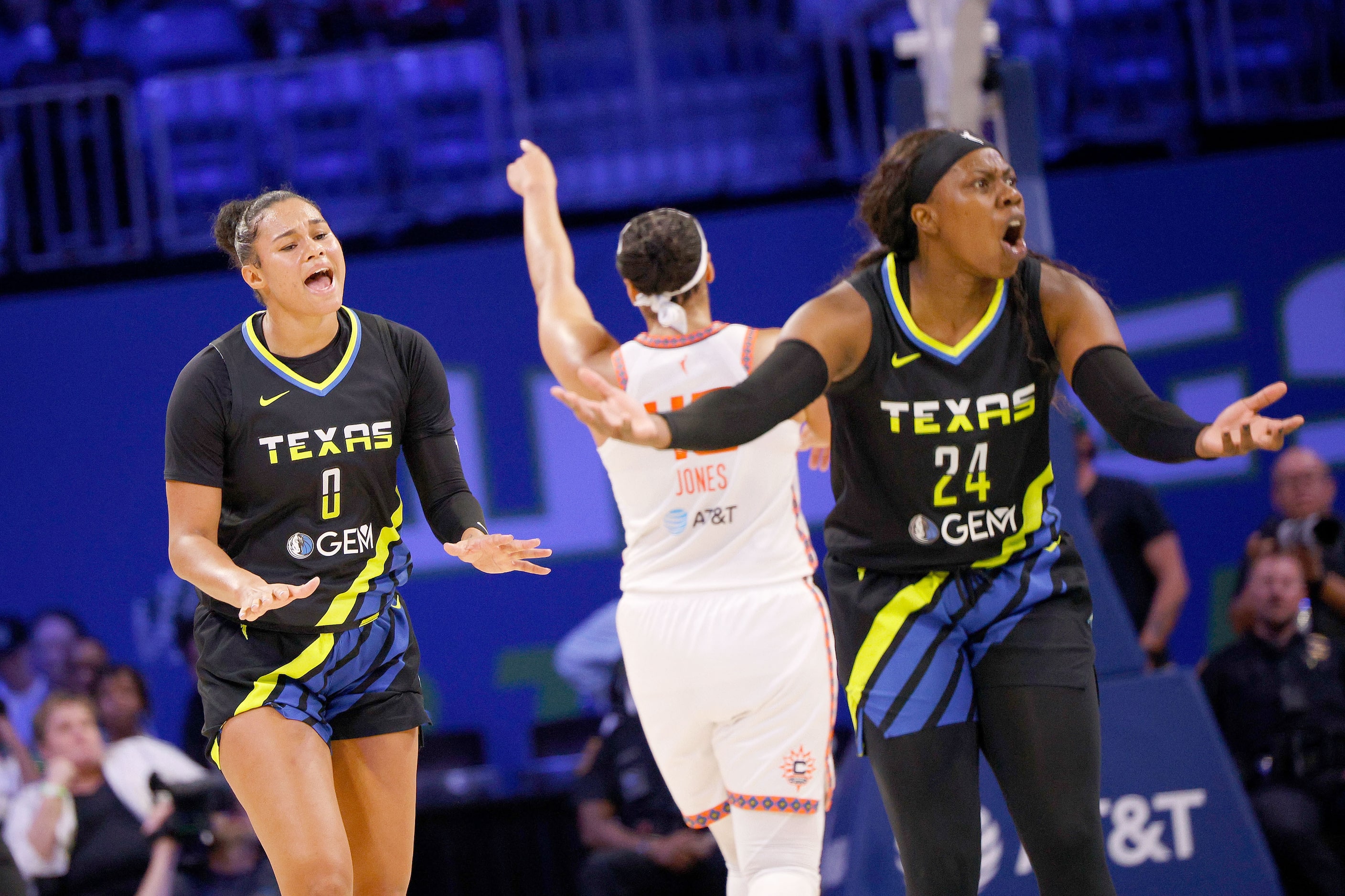 Dallas Wings forward Satou Sabally (0) and Dallas Wings guard Arike Ogunbowale (24) react...