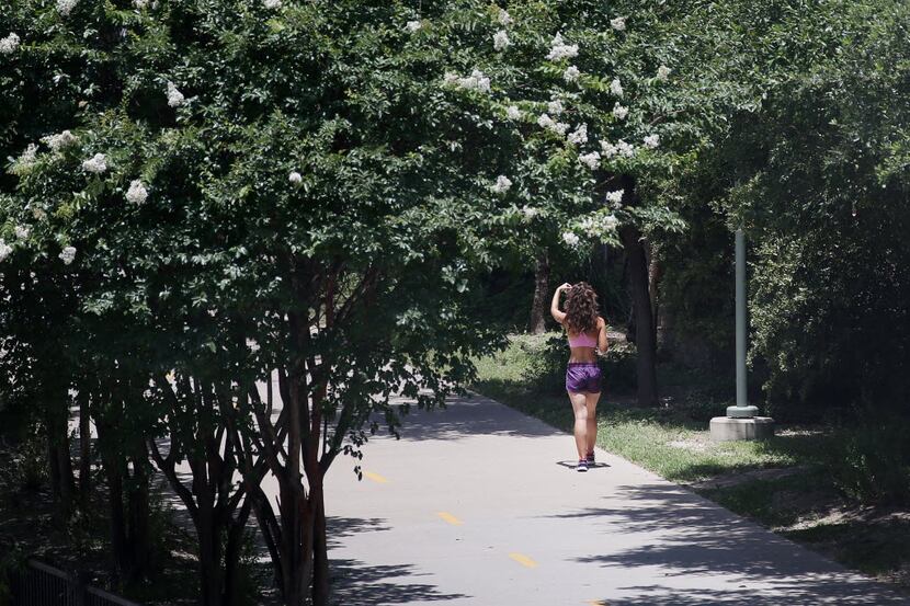 A pedestrian walks along the Katy Trail near the trail's southern terminus north of the...