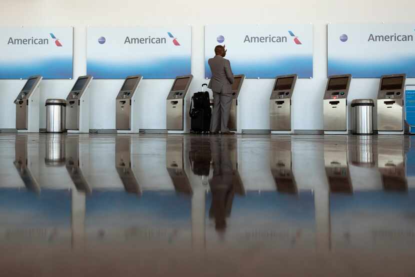 On Nov. 21, 2018, a traveler waved for assistance as he checked in at an American Airlines...