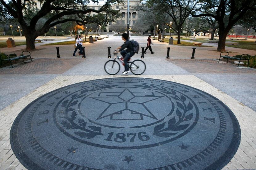 Texas A&M students commute on Military Walk on the Texas A&M University campus in College...