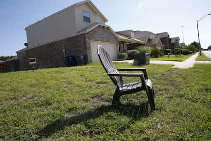 A chair sits on a site marked private property in the Thornton Heights neighborhood in...