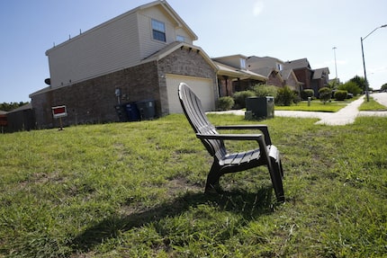 A chair sits on a site marked private property in the Thornton Heights neighborhood in...