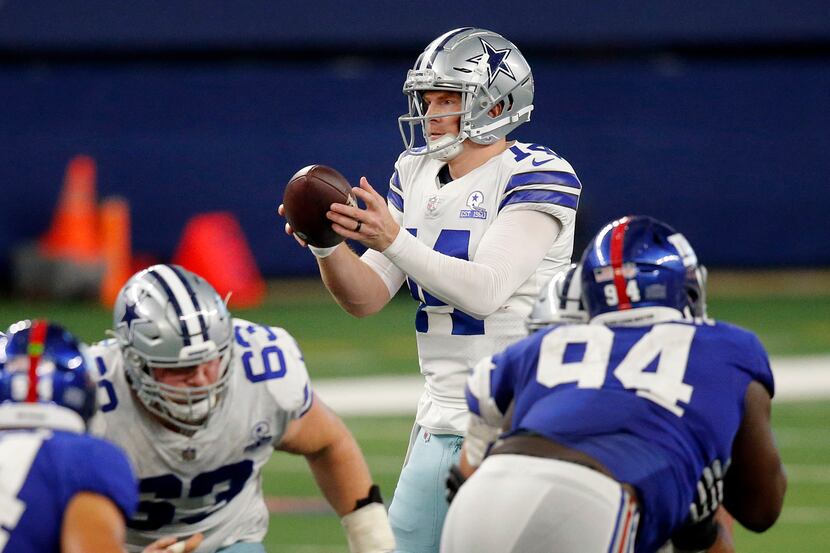 Dallas Cowboys quarterback Andy Dalton (14) takes a fourth quarter snap against the New York...