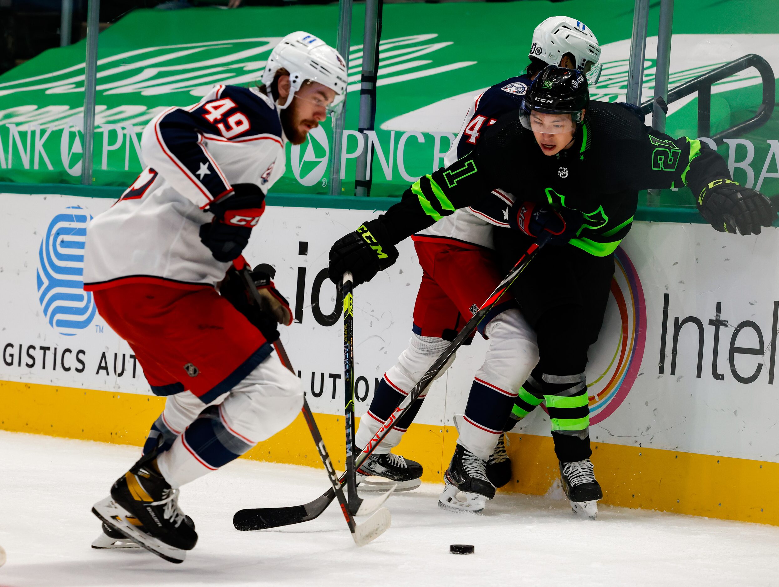 Columbus Blue Jackets center Ryan MacInnis (49) takes the puck from Dallas Stars left wing...