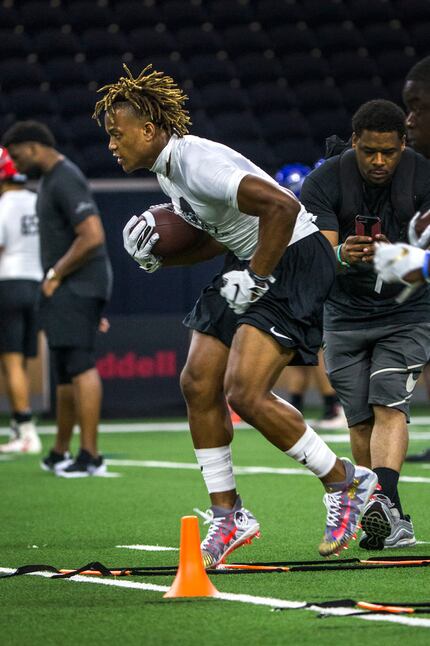 Jase McClellan, of Aledo, Texas runs through a drill during the second day of The Opening at...