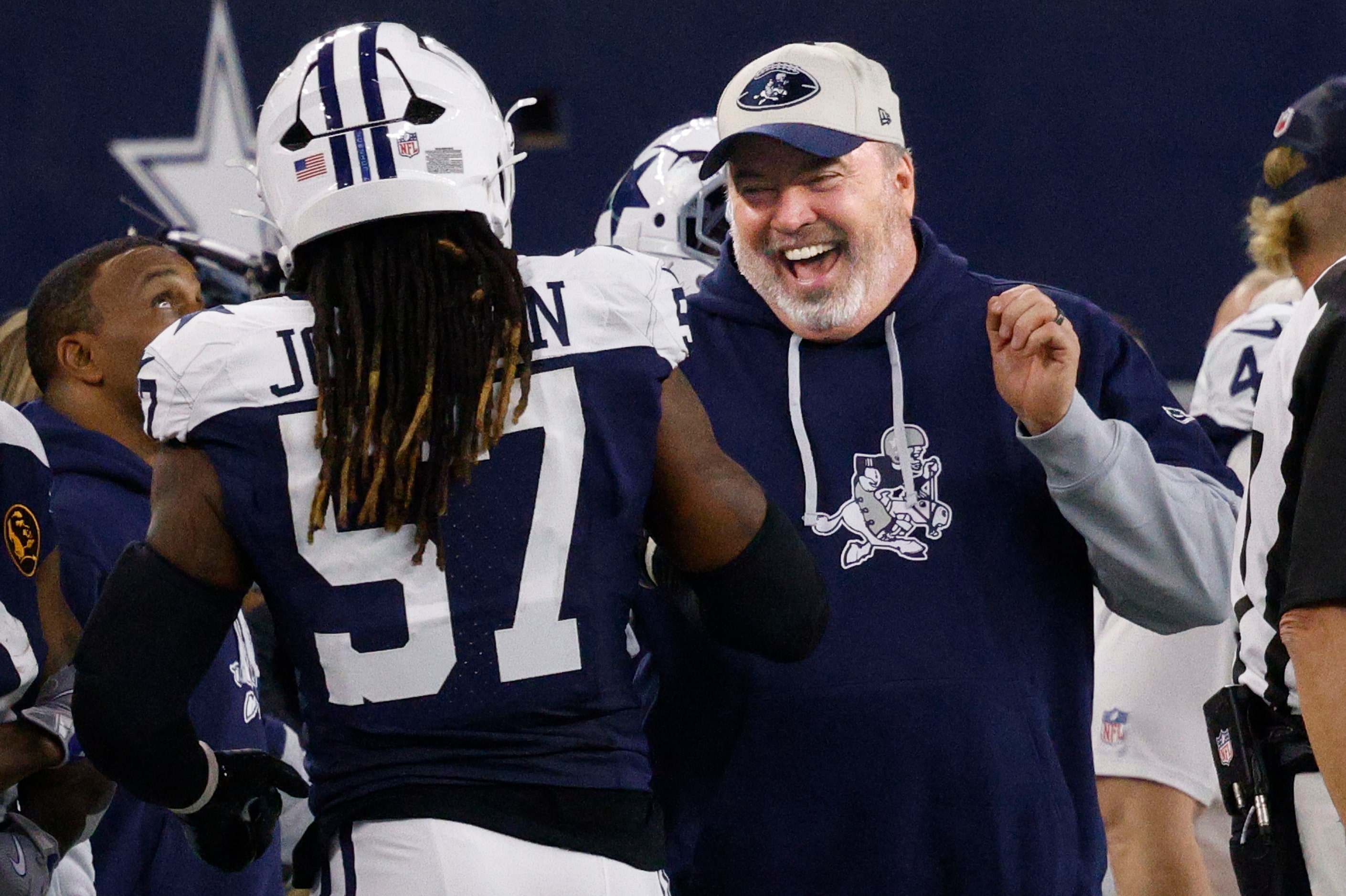 Dallas Cowboys head coach Mike McCarthy smiles to Dallas Cowboys linebacker Buddy Johnson...