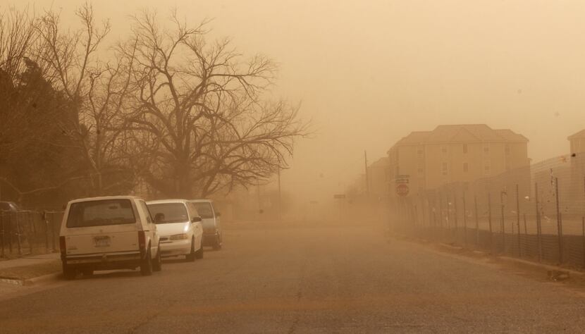 Dust covers a residential area during a dust storm in Lubbock, Texas, Wednesday, Dec. 19, 2012.