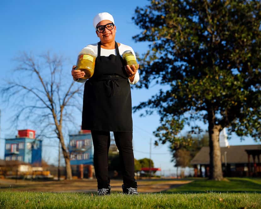 Pinson & Cole's Gourmet Pickles owner Stephanie Pinson-Cole poses with some of her most...