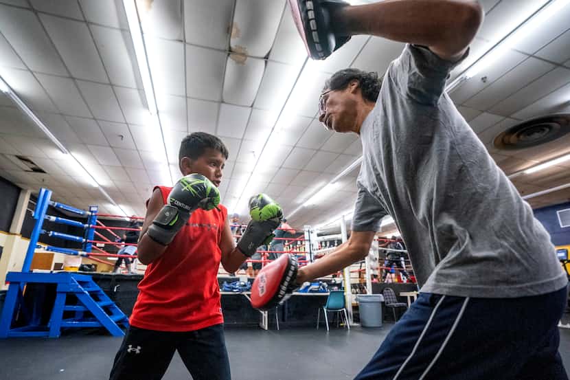 Ricardo Morida, 9, trained with coach Hector Ascencio at the Garland Police 9th Street Gym...