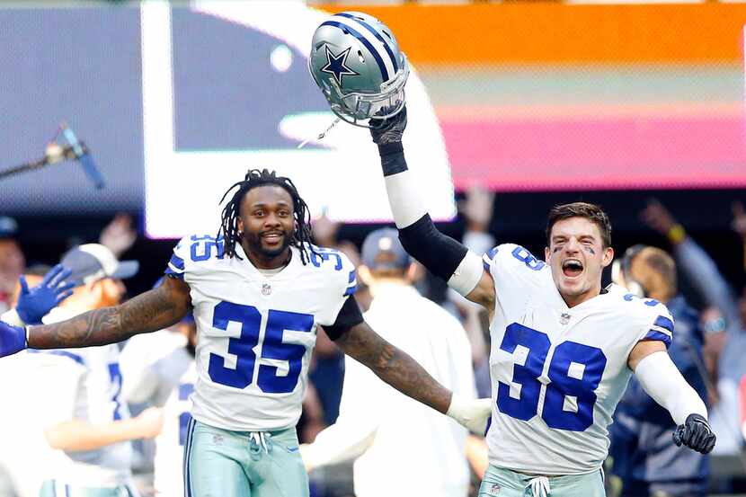 Dallas Cowboys strong safety Jeff Heath (38) and free safety Kavon Frazier (35) celebrate...