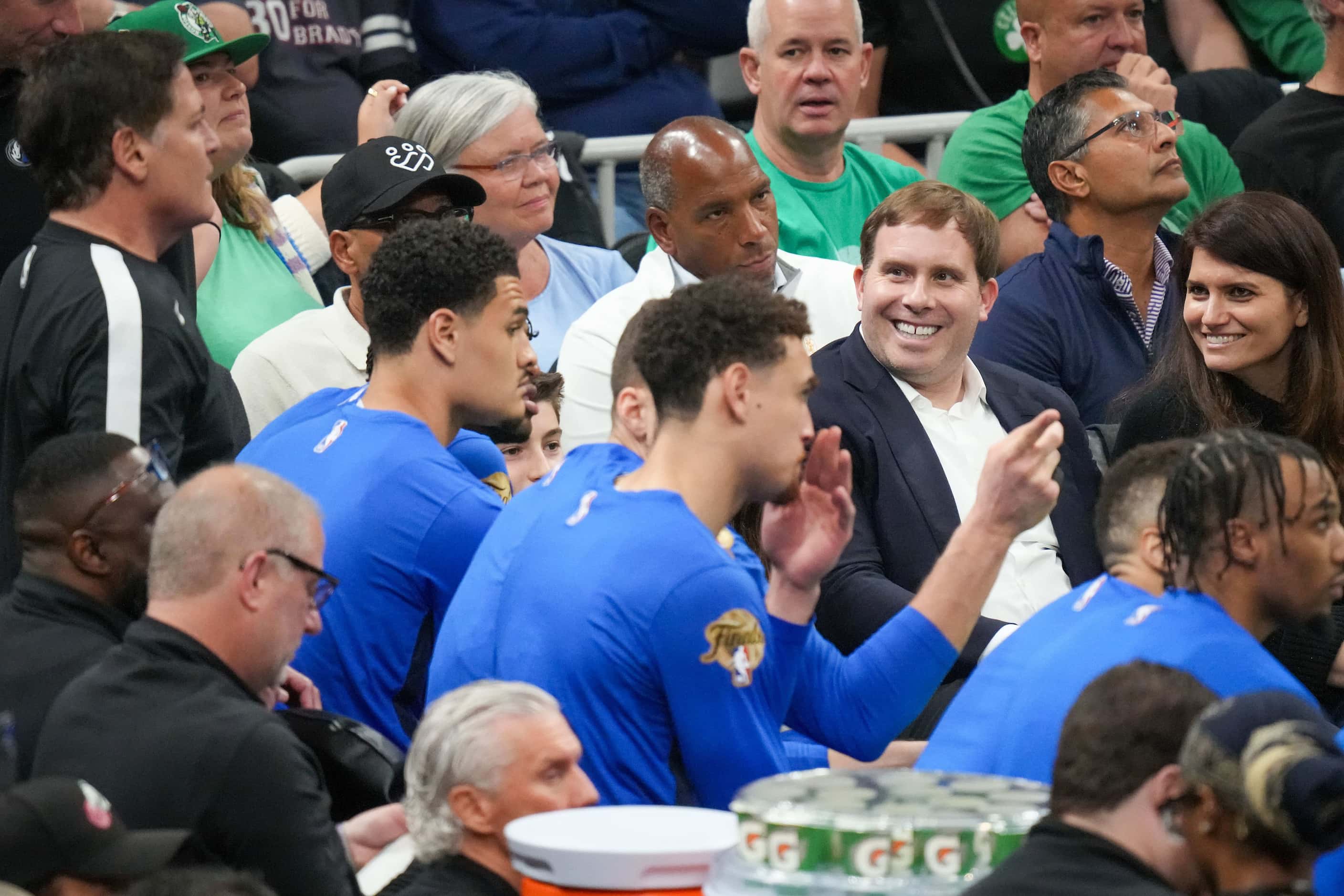 Dallas Mavericks governor Patrick Dumont smiles as he watches from near the bench during the...