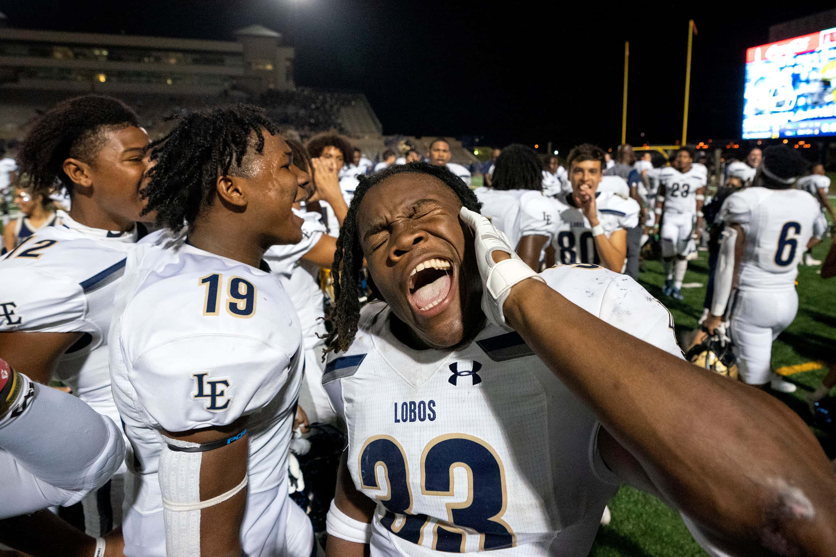 Little Elm sophomore linebacker Osa Adonri (33) leads the crowd in a chant after his team’s...