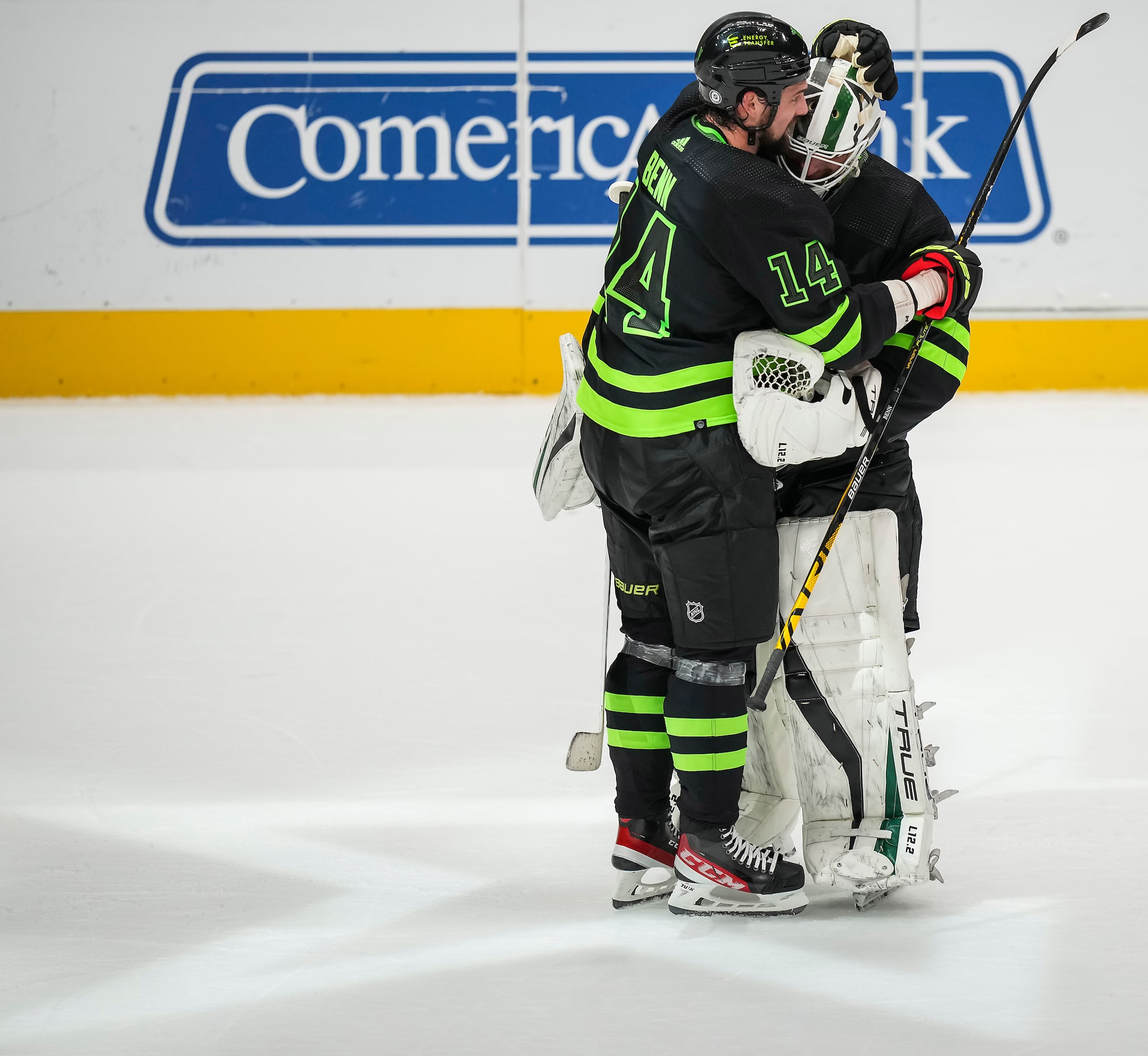 Dallas Stars goaltender Braden Holtby (70) celebrates left wing Jamie Benn (14) after making...