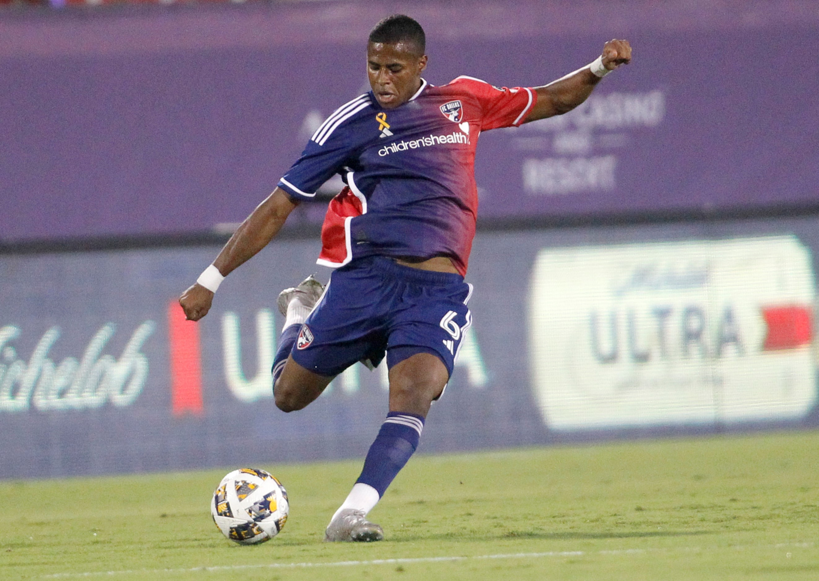 FC Dallas midfielder Patrickson Delgado (6) passes the ball to a teammate during first half...