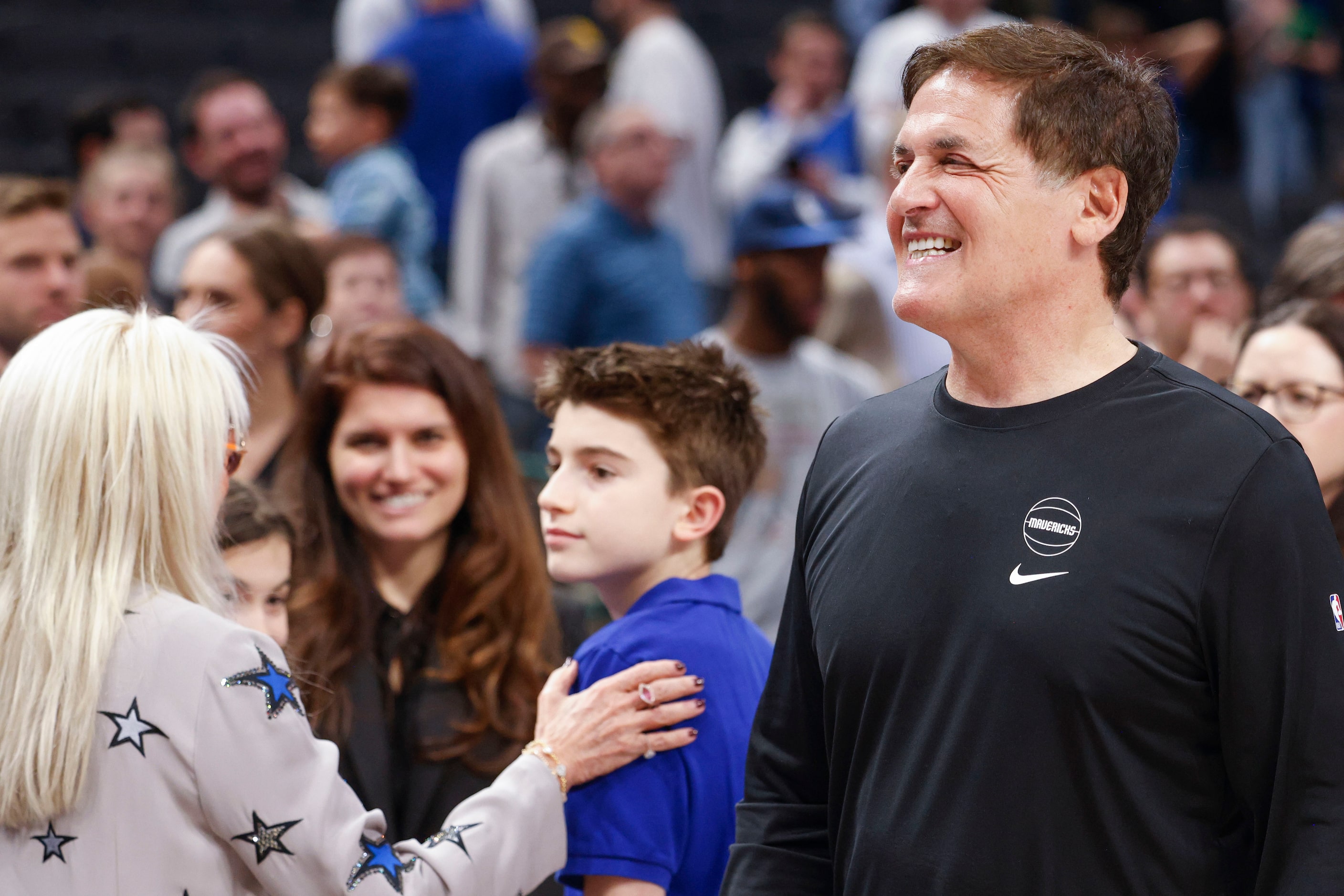 Dallas Mavericks alternate Governor Mark Cuban exits the court after an NBA basketball game...