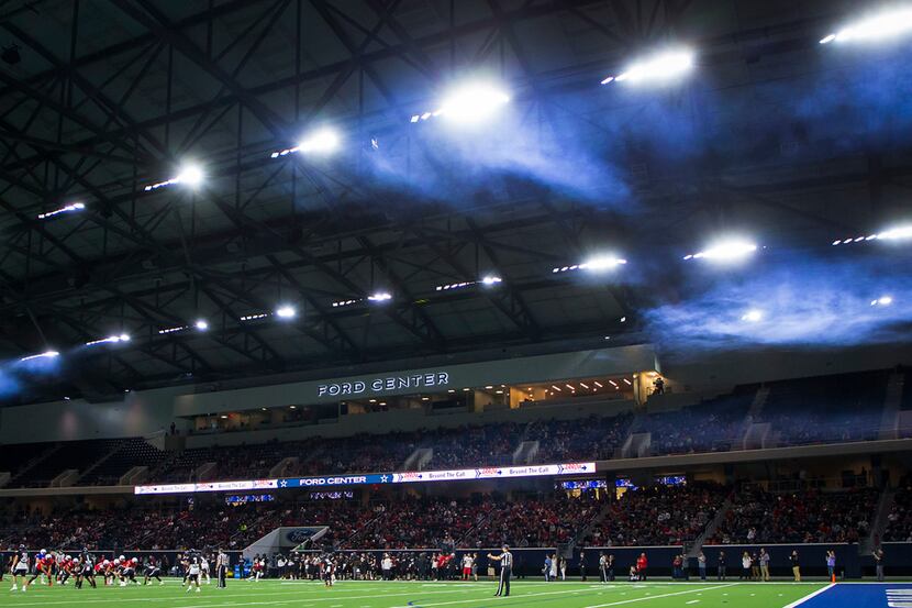 Smoke from pregame introductions hangs over the stadium during the Texas Tech Red Raiders'...