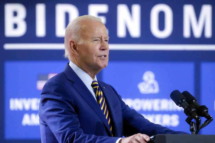 President Joe Biden speaks during a stop at a solar manufacturing company that's part of his...
