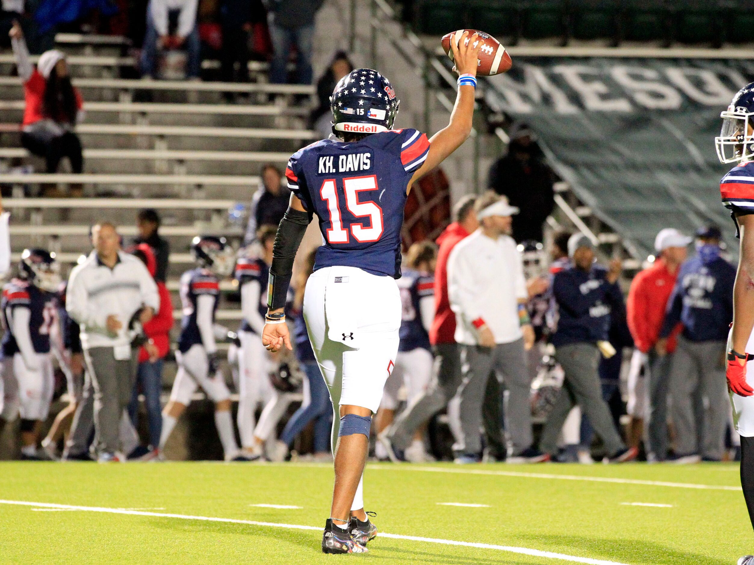 Denton Ryan QB Khalon Davis (15) holds the ball high, as time runs out in Ryan’s 37-33 win...