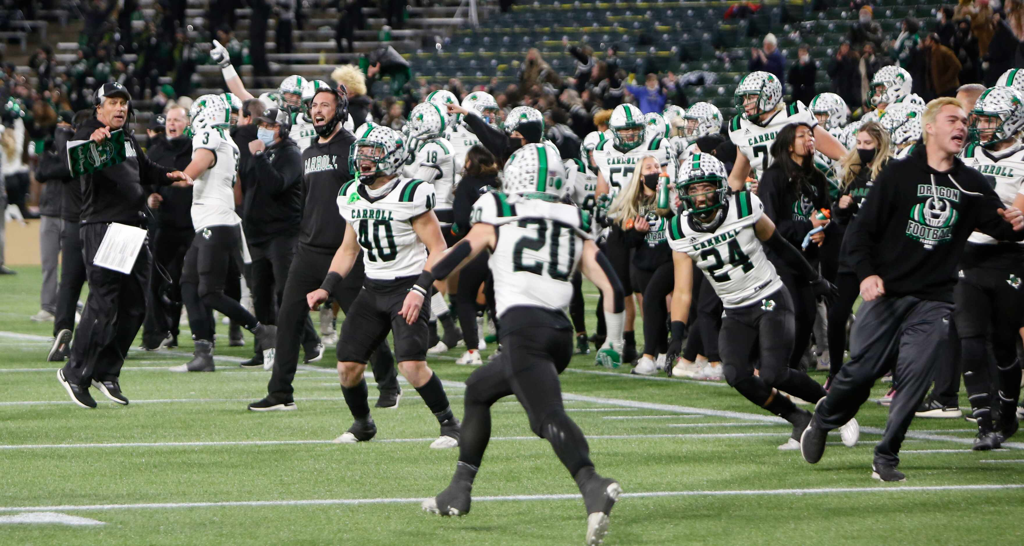 The Southlake bench erupts at a change of possession during the final seconds of the fourth...