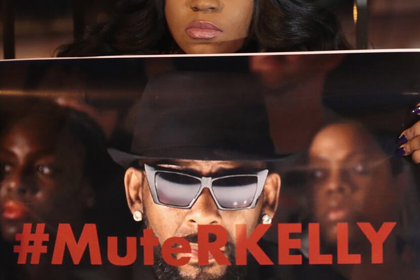 Demonstrators gather near the studio of singer R. Kelly to call for a boycott of his music...