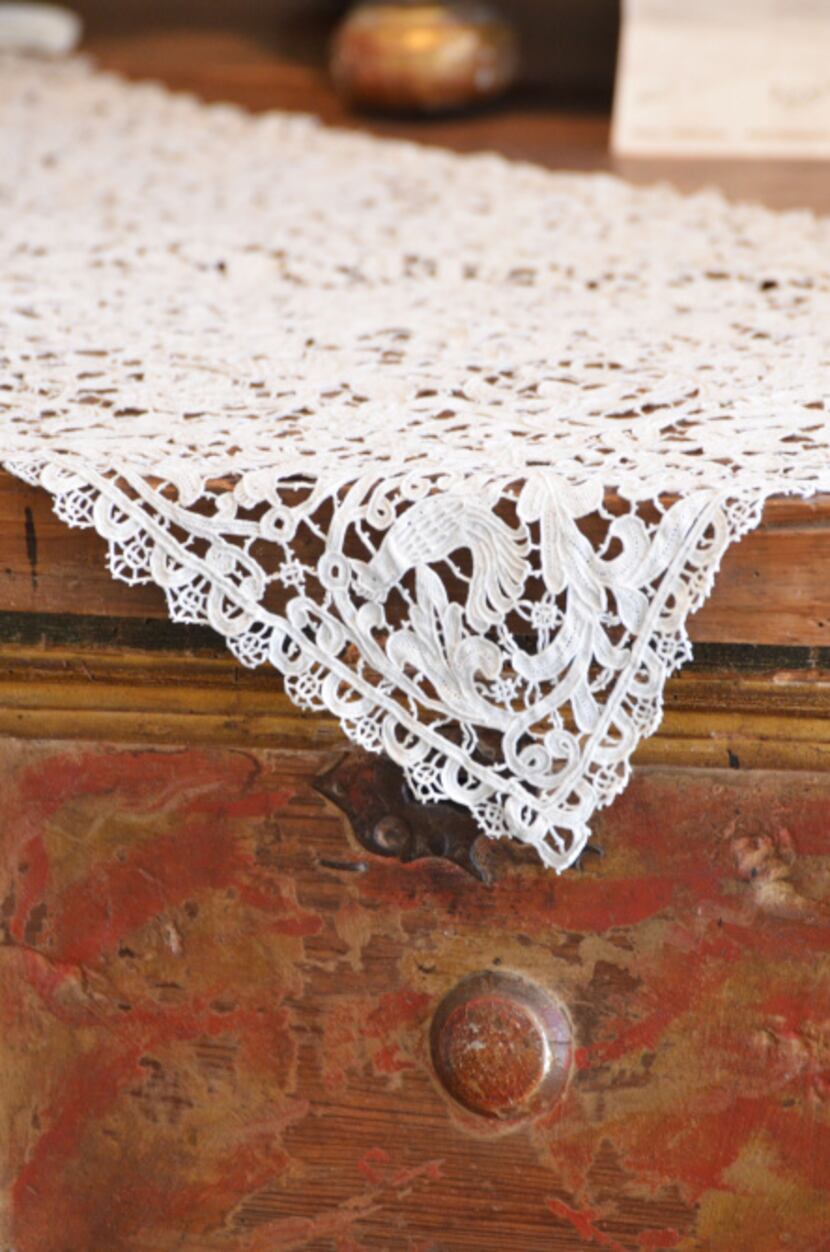 Antique linens by de Balthazar are showcased at the Mews in the Dallas Design District. She...