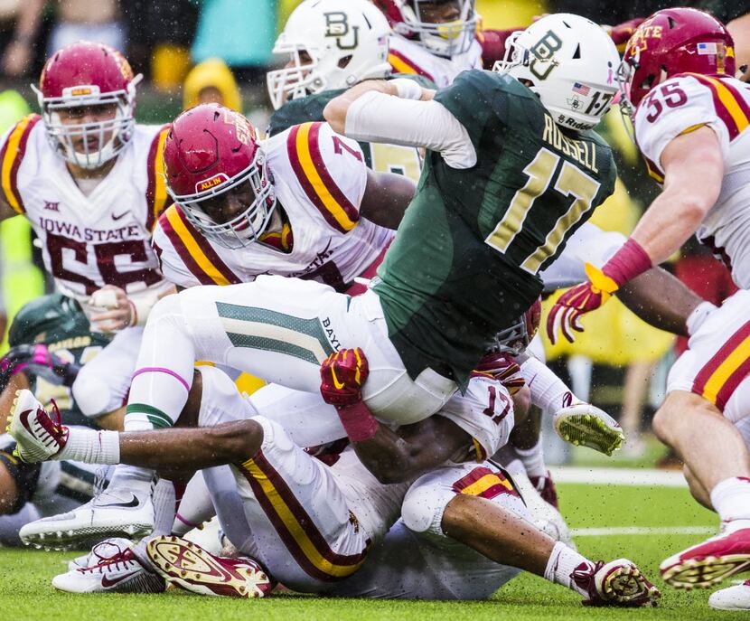 Baylor Bears quarterback Seth Russell (17) is tackled by Iowa State Cyclones defensive back...