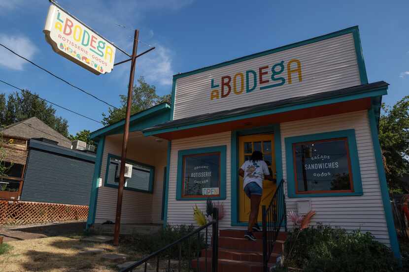 A customer walks into  La Bodega on Thursday, July 21, 2022 in Dallas.
