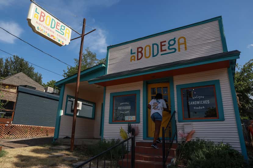 A customer walks into  La Bodega on Thursday, July 21, 2022 in Dallas.