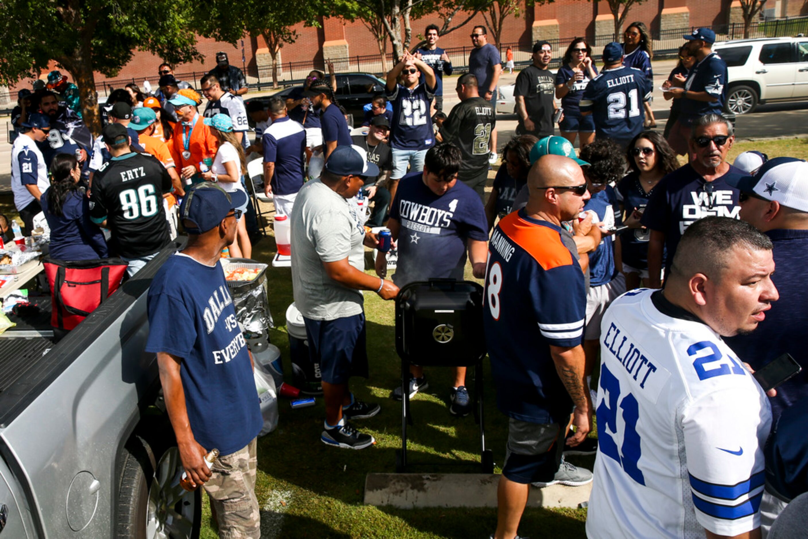 Fans tailgate before an NFL game between the Miami Dolphins and the Dallas Cowboys on...