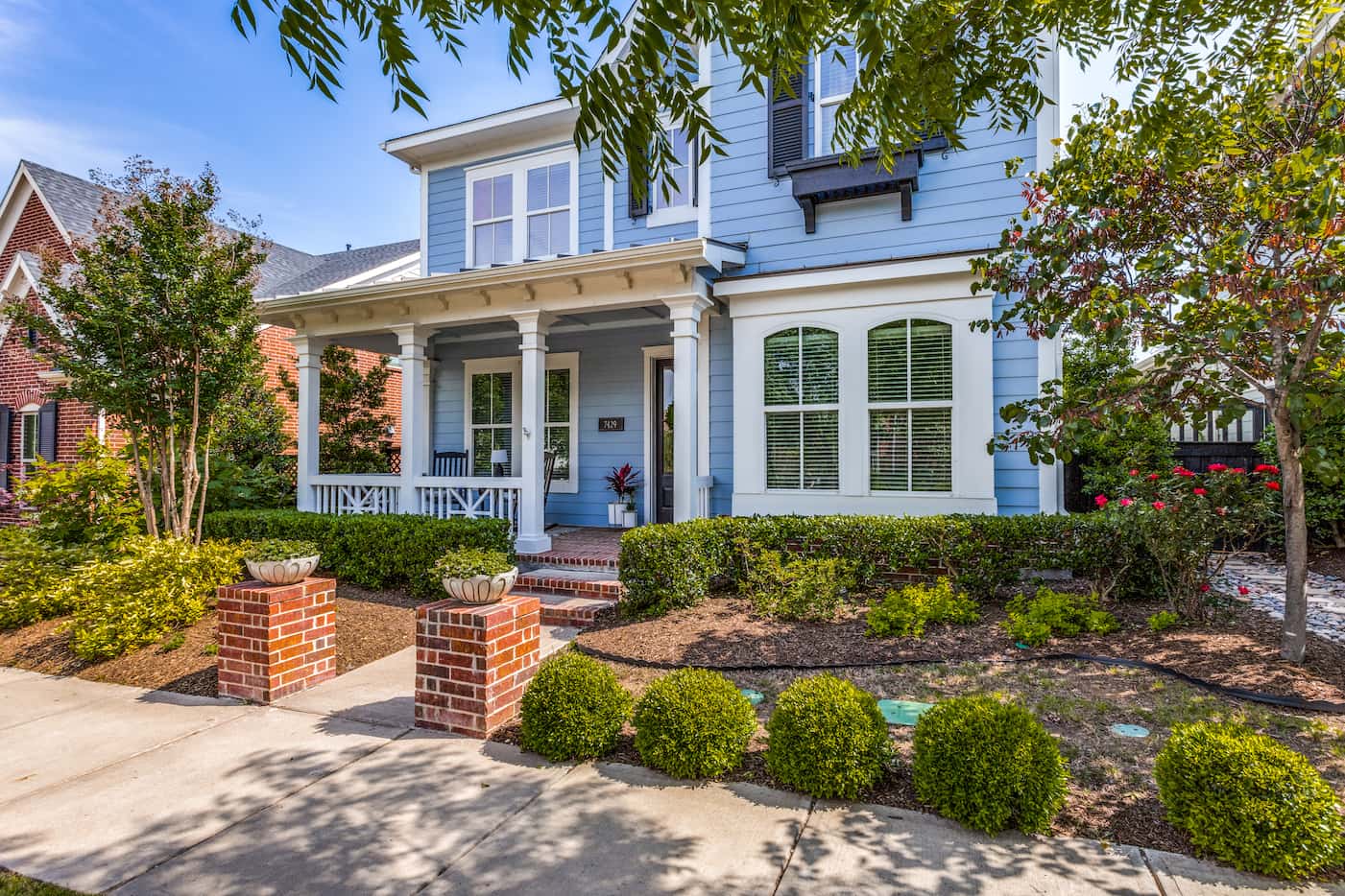 The charming blue home is tucked into the Tucker Hill neighborhood in McKinney.