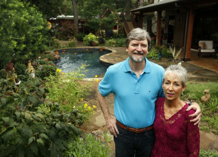 Rob and Suzy Renz pose for a portrait in their backyard garden at their home in Dallas on...