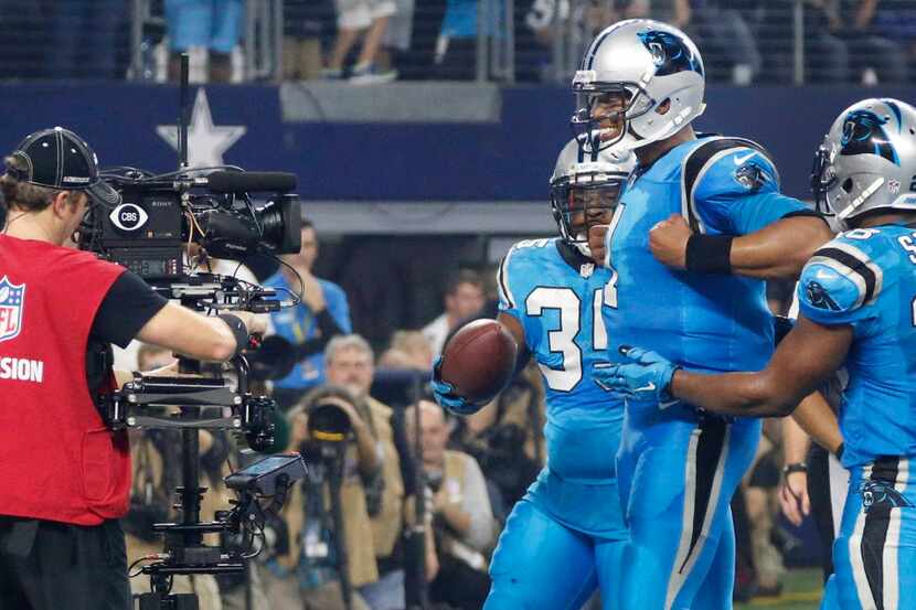Carolina Panthers quarterback Cam Newton (1) smiles for the camera after scoring a touchdown...