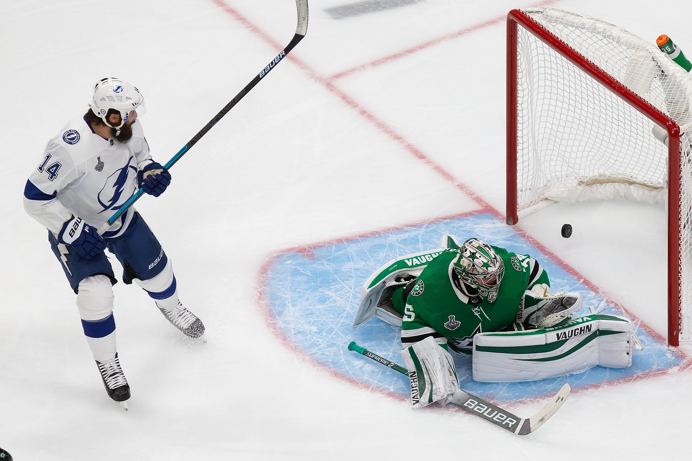 Goaltender Anton Khudobin (35) of the Dallas Stars and Pat Maroon (14) of the Tampa Bay...